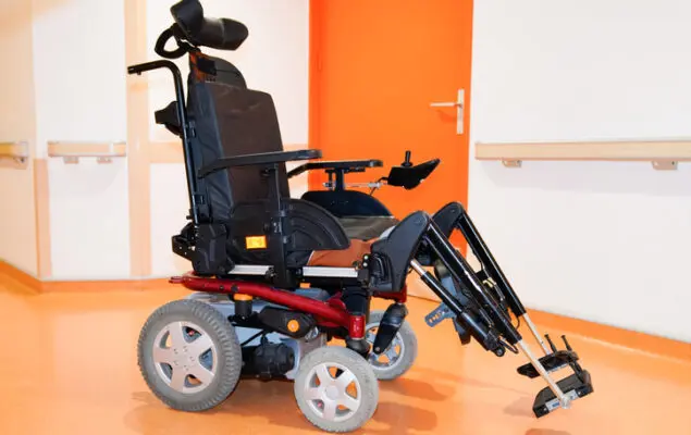 disabled electric chair empty in corridor hospital wheelchair indoors