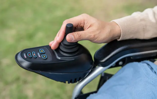 woman patient on electric wheelchair with joystick and remote control at nursing hospital ward, healthy strong medical concept