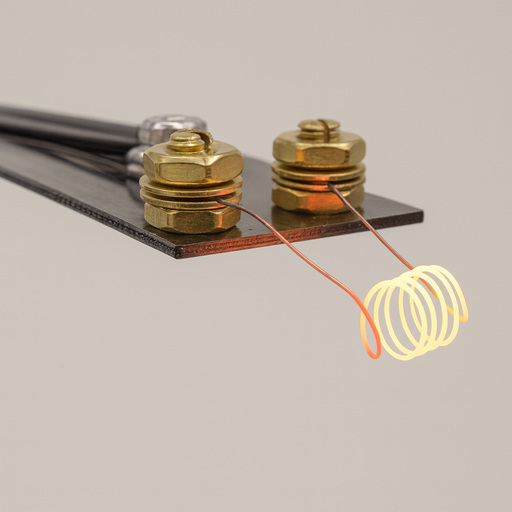 Heat testing setup using a coil to represent an ignition source