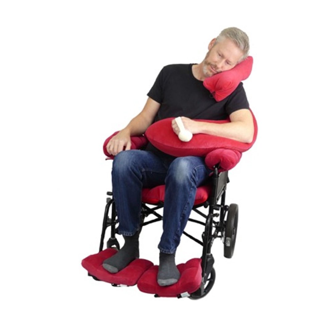 wheelchair user with red arm-support pillow
